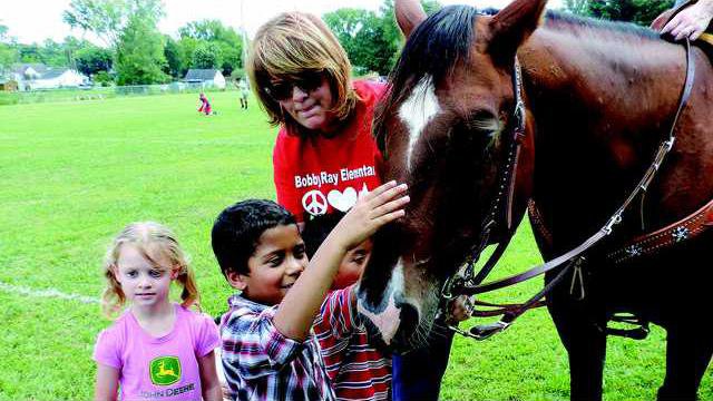 4 kids with horse