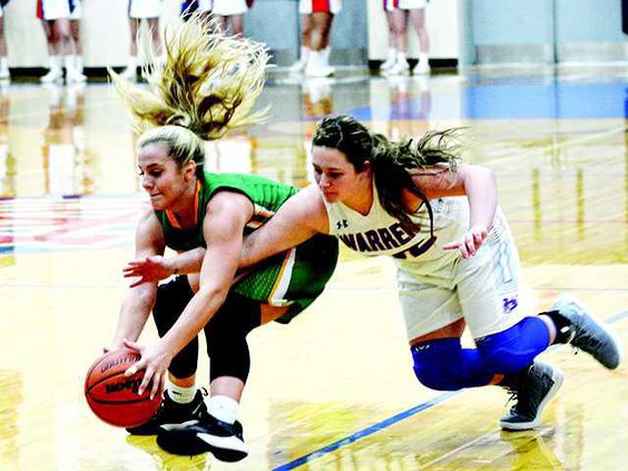 Lady Pioneers fight for ball --