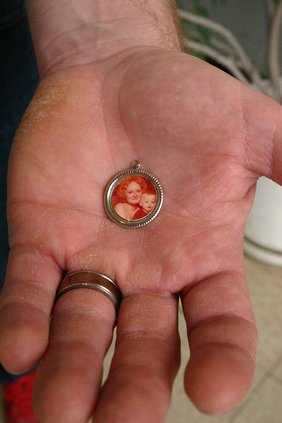 Mental Health- Stotts' hand with photo of mother.jpg