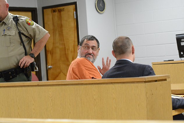 Top 10 - Marty Judd waves to family at his preliminary hearing.jpg